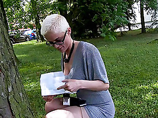 Short hair blonde solo model giving toy handjob via gloryhole